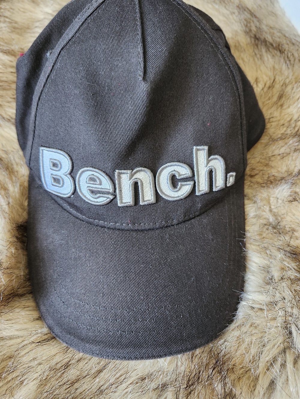 Unisex Bench. Black Logo Baseball Cap